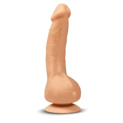 Vibrador realista Greal de silicona BioSkin color carne, con su cargador USB magnético.